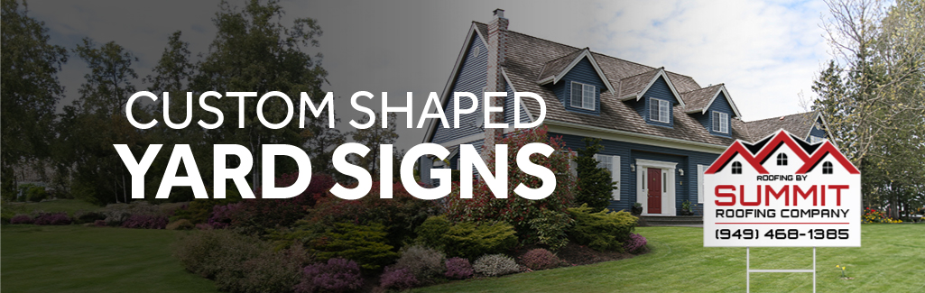 Custom shaped yard sign of a house advertising a realty company on a grassy lawn in front of a house.