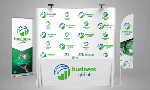 Trade show booth with rectangle flag, banner retractor, feather flag with a table and white table cover in front. All products advertise with a circular logo of half a blue sphere and green bar graph next to green text saying Business and blue text saying Global.
